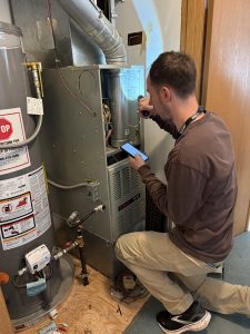 Weatherization Team checking appliances